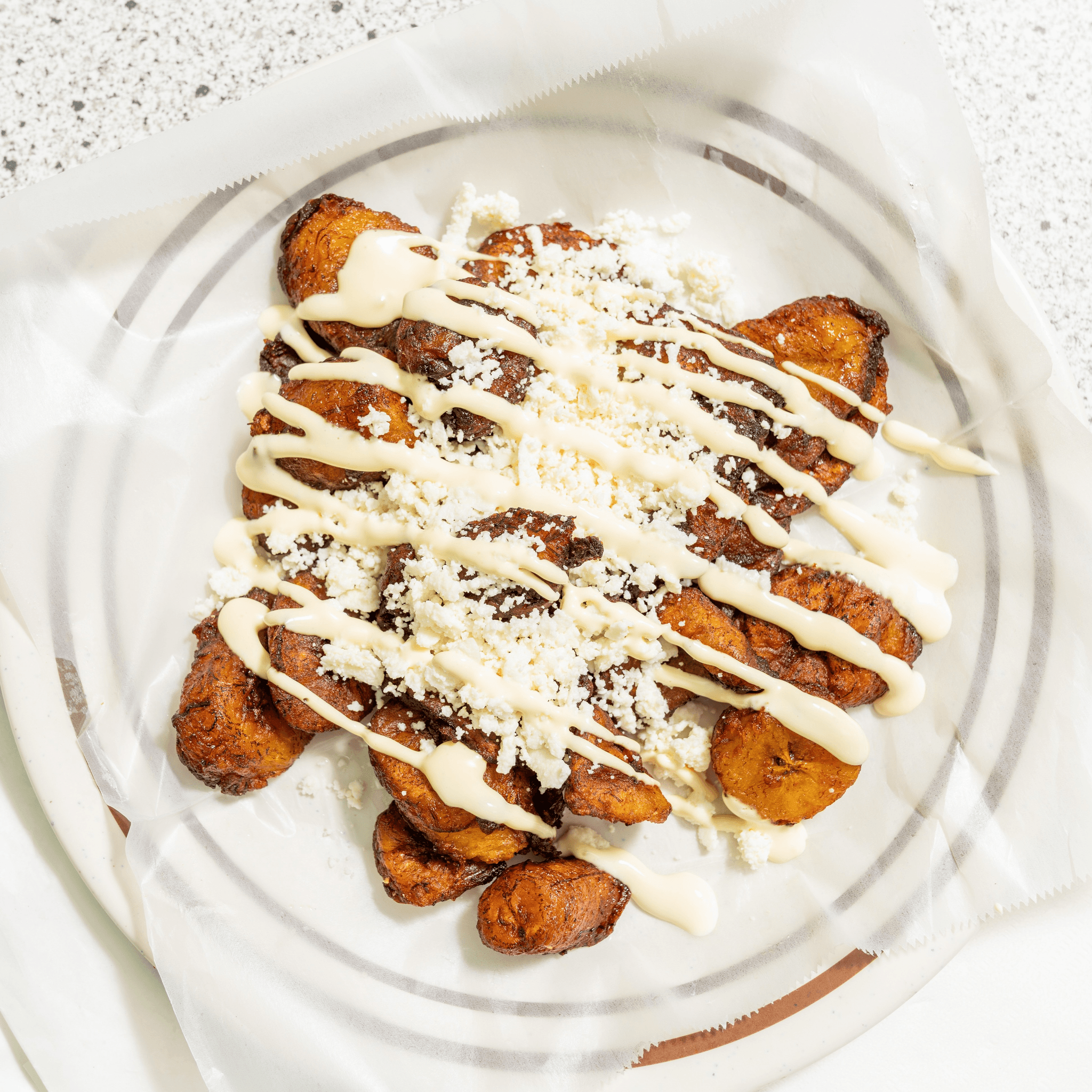 Platanos Fritos Queso Y Crema (Sour Cream and cheese).